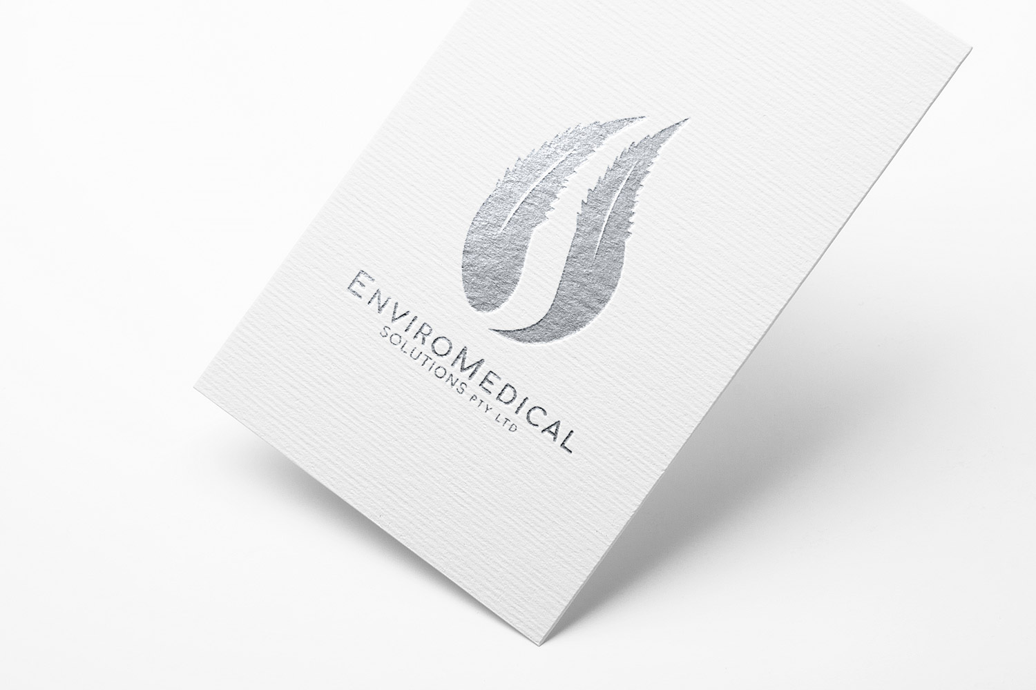 Silver EnviroMedical Solutions logo printed on a business card